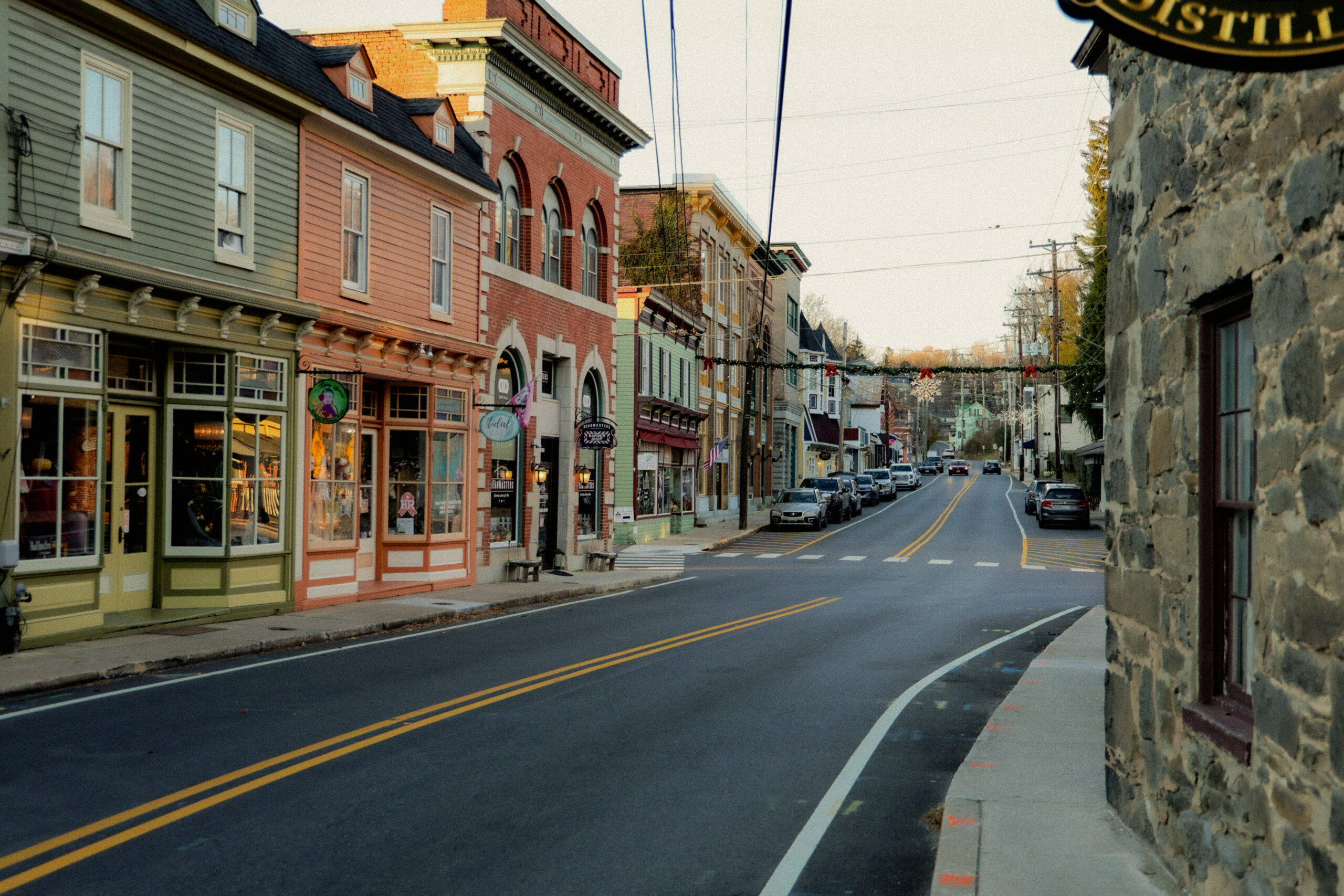 Historic brick buildings and storefront sign in downtown Sykesville Maryland